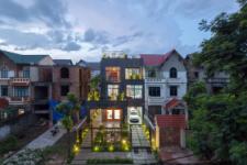 The abandoned house stands out in the middle of the renovated neighborhood